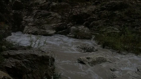 Muddy stream of water in a mountain river. Video stock 83774586