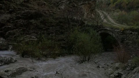 Muddy stream of water in a mountain river. Stock Footage 83774644