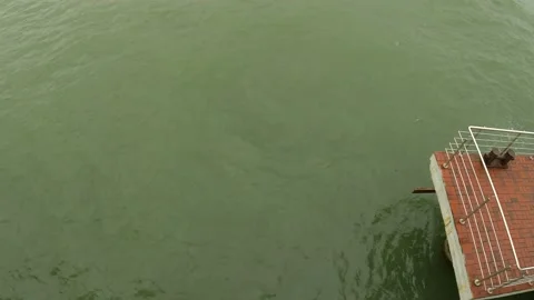Muddy water during a storm under the pier Stock Footage 163204717