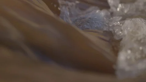 Muddy water gushing forcefully Stock Footage 79786115