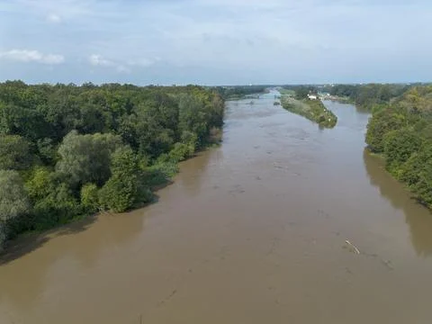 Mudflow of water in the Oder River of brown color. Poland. View from above... Stock Photos