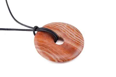 Mudline stone donut on leather string Stockfoto's