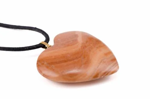 Mudline stone heart with leather string 库存照片