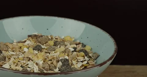 Muesli in a bowl closeup rotating loopable Stock Footage 148659207