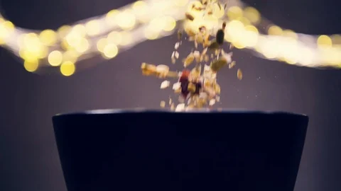 Muesli, cereal, corn flakes falling in a bowl Stock Footage 128554299