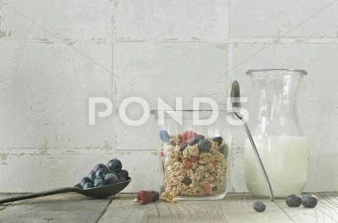 Muesli with fresh blueberries and dried raspberries Stock Photos
