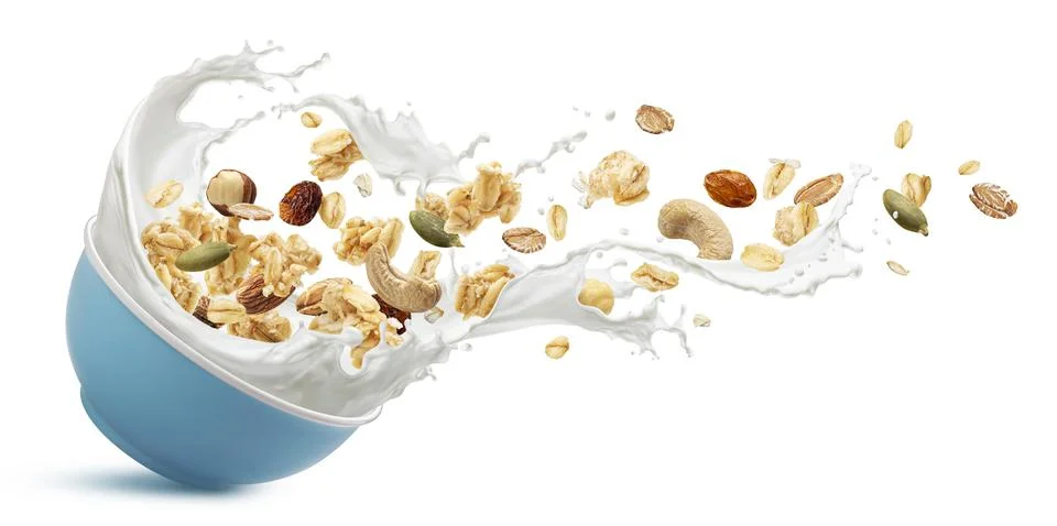 Muesli, oat granola with milk splash Stock Photos