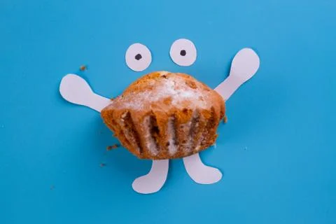 Muffin on the blue background Stock Photos