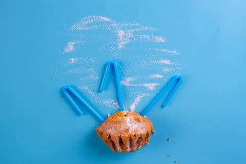 Muffin on the blue background Stock Photos