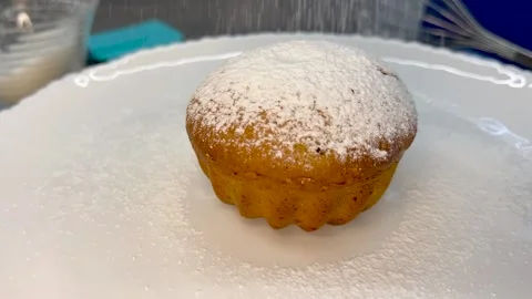 Muffin in powdered sugar. Video stock 211441172