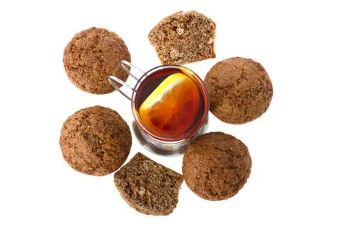 Muffin with tea on white Stock Photos