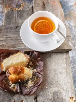 Muffins and flavored tea on a rustic wooden background. Close-up Stock Photos