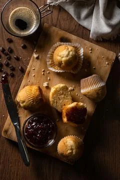 Muffins and raspberry jam on table Stock Photos