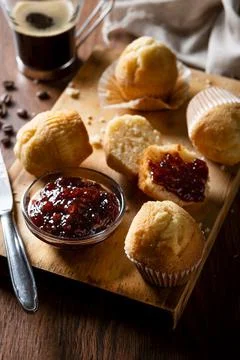 Muffins and raspberry jam on table Stock Photos
