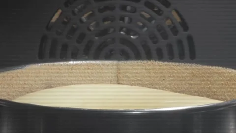 Muffins baking and rising in muffin tin in electric oven at home close up, zoom Stock Footage 336576655