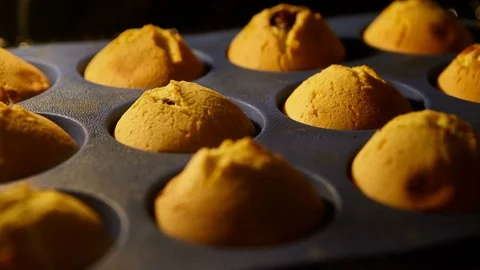 Muffins. Baking in oven. Time lapse footage of cooking Cupcakes. 4k, UHD Stock Footage