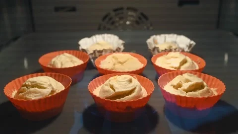 Muffins. Baking in oven. Time lapse footage of cooking Cupcakes. close up, loop Stock Footage 197441382