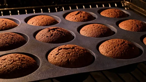Muffins. Baking in oven. Time lapse footage of cooking cupcakes. Bakery concept Stock Footage 231578487