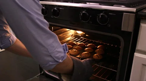 Muffins being removed from oven Stock Footage 61404258