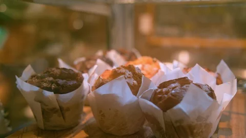 Muffins in cafe window Stock Footage 86931460
