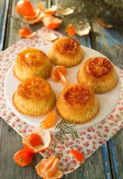 Muffins with caramelized mandarins. Rustic style, selective focus. Stock Photos