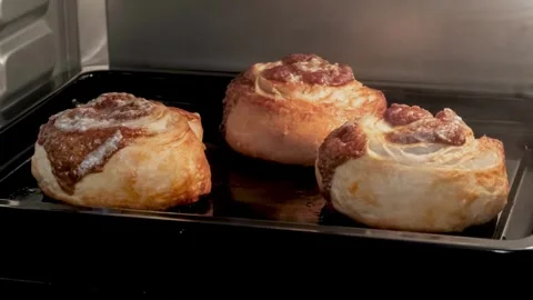 Muffins cooking in the oven. Time lapse footage of growing cupcakes. Homemade Stock-Footage 336576856