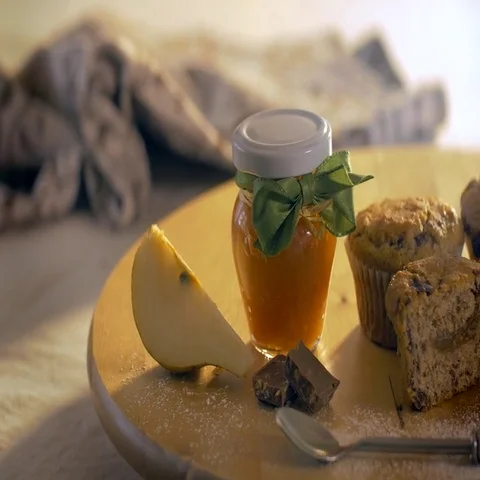 Muffins, a jar of jam and a pear. Healthy homemade breakfast to start the day. Stock Footage 69712108