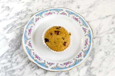 Muffins on a plate on a marble table Stock Photos