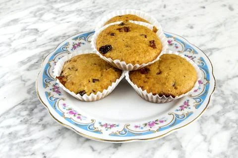 Muffins on a plate on a marble table Stock Photos