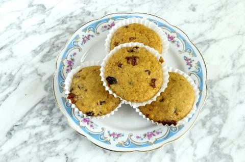 Muffins on a plate on a marble table Stock Photos