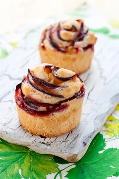 Muffins with plums Stock Photos