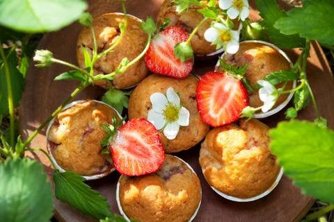 Muffins with strawberries Stock Photos