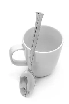 Mug and spoon Stock Photos