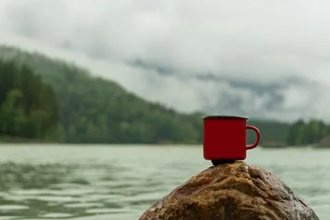 Mug on the background of mountains 写真素材