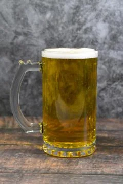 Mug of beer on a bar Stock Photos