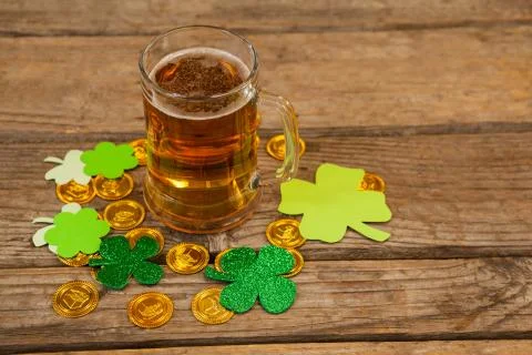Mug of beer, chocolate gold coins and shamrock for St Patricks Day Stock Photos