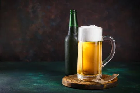 Mug of beer on dark background Stock Photos