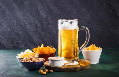 Mug of beer on dark background Stock Photos