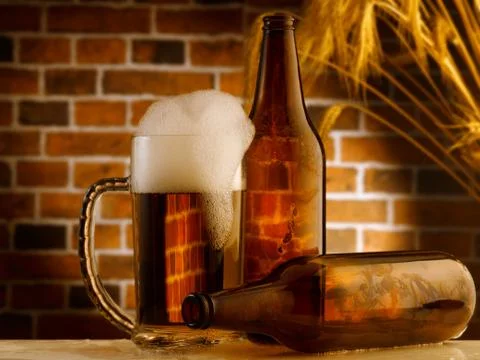 Mug of beer in rustic setting Stock Photos