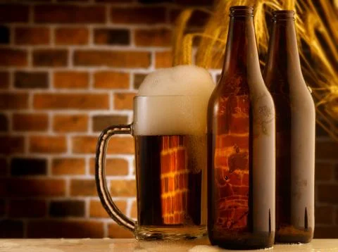 Mug of beer in rustic setting Stock Photos