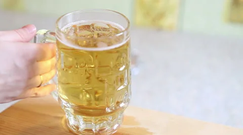 Mug with beer taken from the table, close-up Stock Footage 60397208