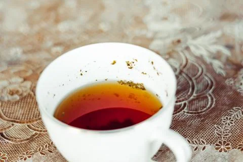 Mug with brewed tea from grass Stock Photos