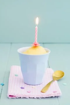 Mug cake with candle Stock Photos