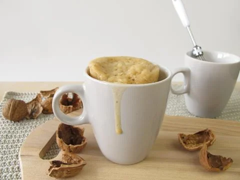 Mug cake with walnuts from microwave Stock Photos