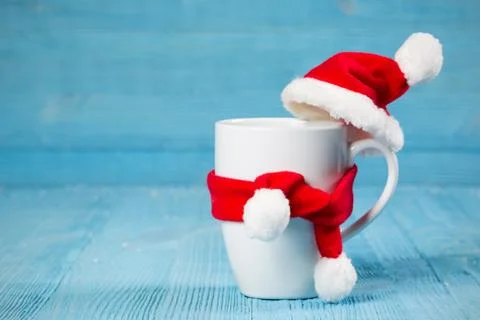 Mug in a cap and scarf Stock Photos