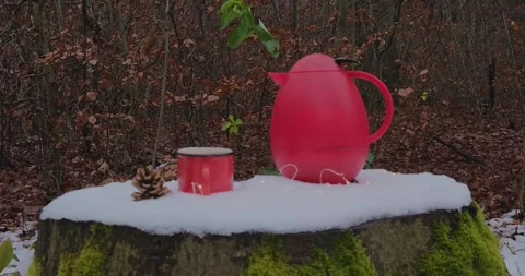 Mug of coffee on the background of the winter forest Stock Footage 169875606
