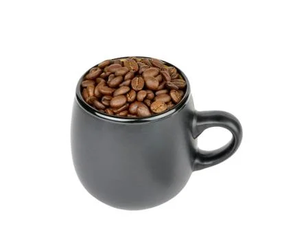 Mug with coffee beans Stock Photos