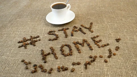 Mug of coffee, coffee beans, and words stay home, coronavirus concept, self h Video stock 128756396