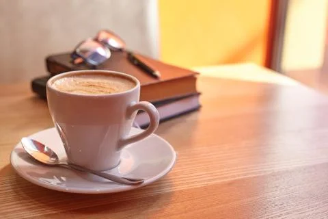 Mug with coffee on a diary with glasses Stock Photos