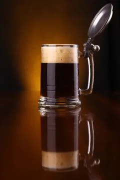 Mug of dark beer Stock Photos